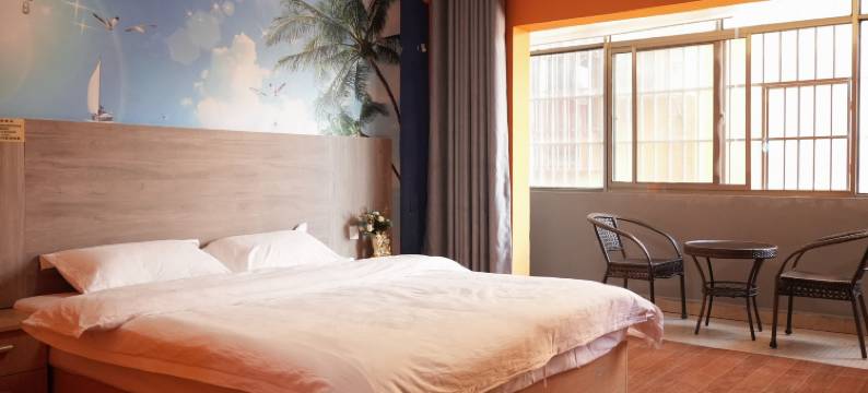 芒果御园酒店(景洪曼听公园店)图片