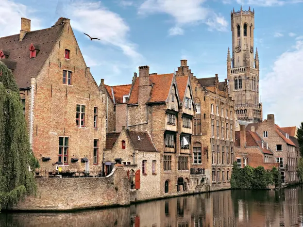 Side view of Bruges buildings and the canal