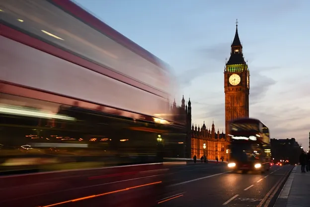 Buses passing the Parliament in London