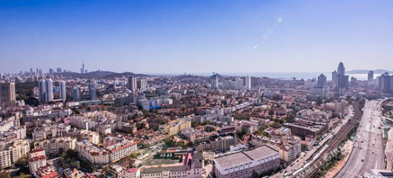 日光海岸度假公寓(青岛中联自由港湾店)图片