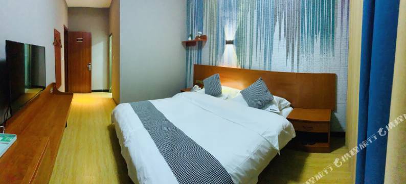 锦辉商务酒店(弥勒湖泉生态园巨人世纪广场店)图片