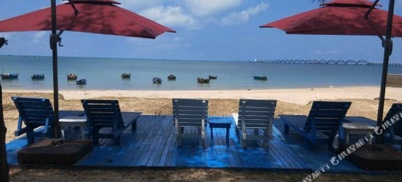 涠洲夕阳海岸沙滩木屋图片