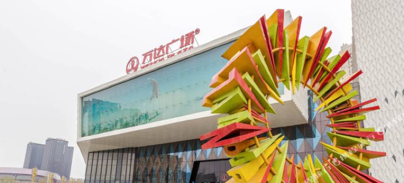 开心曼居酒店(哈尔滨哈西高铁西站万达广场店)图片