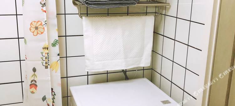 青岛化羽成蝶公寓图片