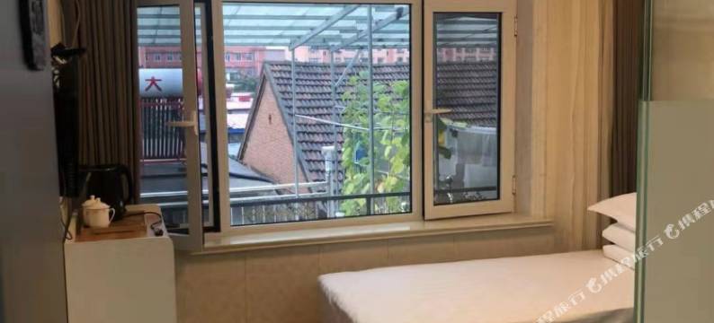 岫岩迎宾快捷客房图片